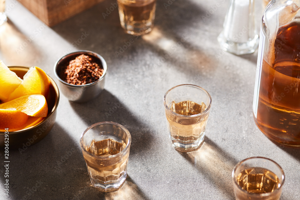 Spirit alcoholic shots with segments of orange. Spirit alcoholic shots with segments of orange.