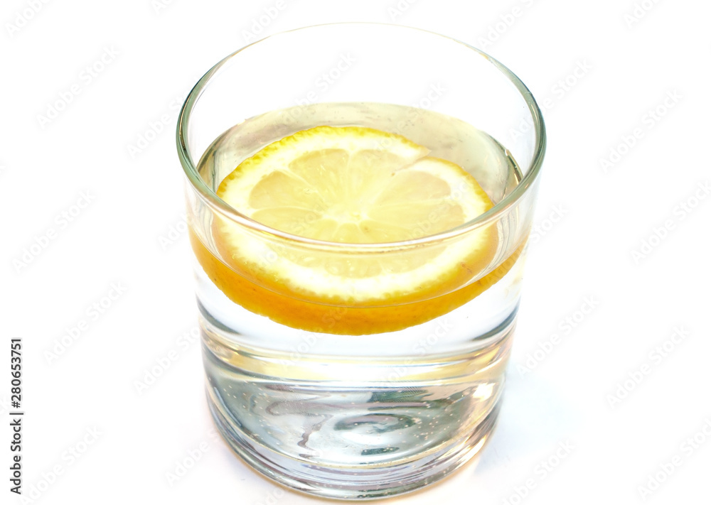 Glass of pure water with lemon isolated on a white background