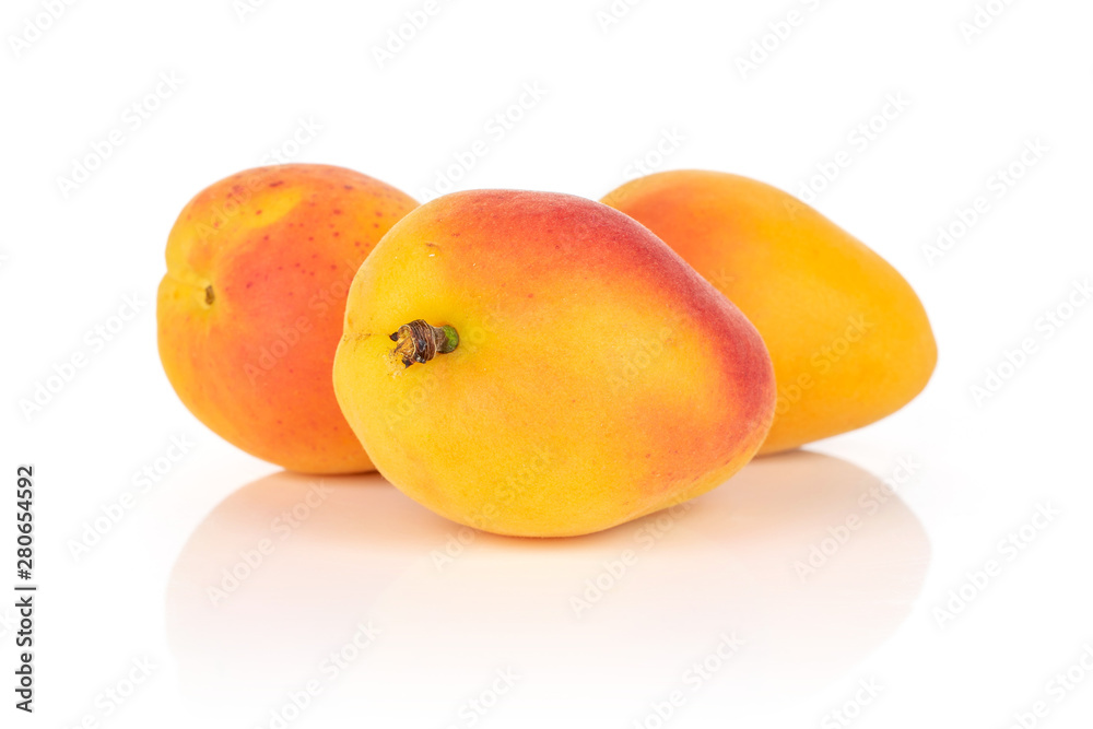 Group of three whole fresh orange apricot isolated on white background Group of three whole fresh orange apricot isolated on white background
