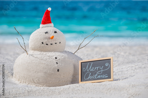 Photography Australian Christmas Sandman with decoration and with a board of Merry Christmas
