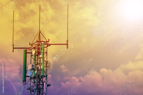 communication tower or 4G 5G network telephone cellsite with cloudy sky on sunset photo