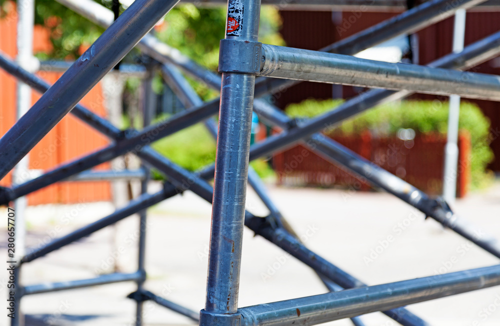Umea, Sweden - June 24, 2019: scaffolding mounted on Roback for repainting facade Umea, Sweden - June 24, 2019: scaffolding mounted on Roback for repainting facade