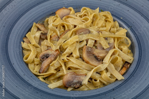 Italian pasta - Fetucini Alfredo on the plate photo