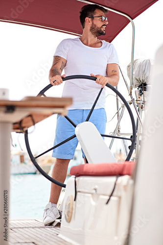 Cruise vacation. man enjoying a summer day on a boat.