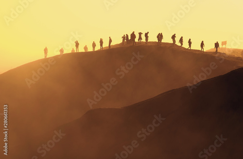 Tourists climbing to Mount Bromo volcano summit at sunrise © PRADEEP RAJA