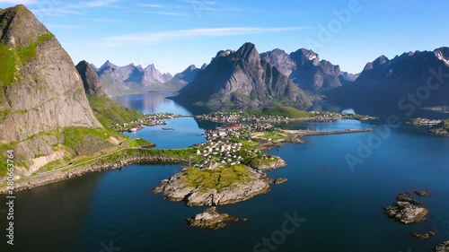 aerial view. flight over the sea,view on Reine and Hamnoya village .the Camera move right to left .Lofoten Islands,Norway.Camera move backward