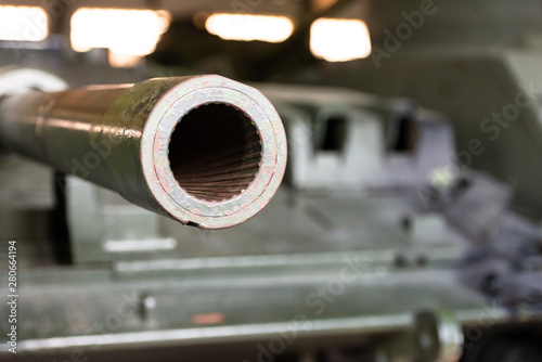 Barrel of the tank close-up. Rifled barrel of military weapons.