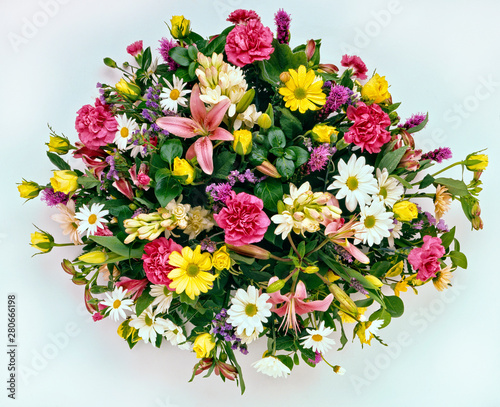 A bouquet of assorted flowers on a white background 