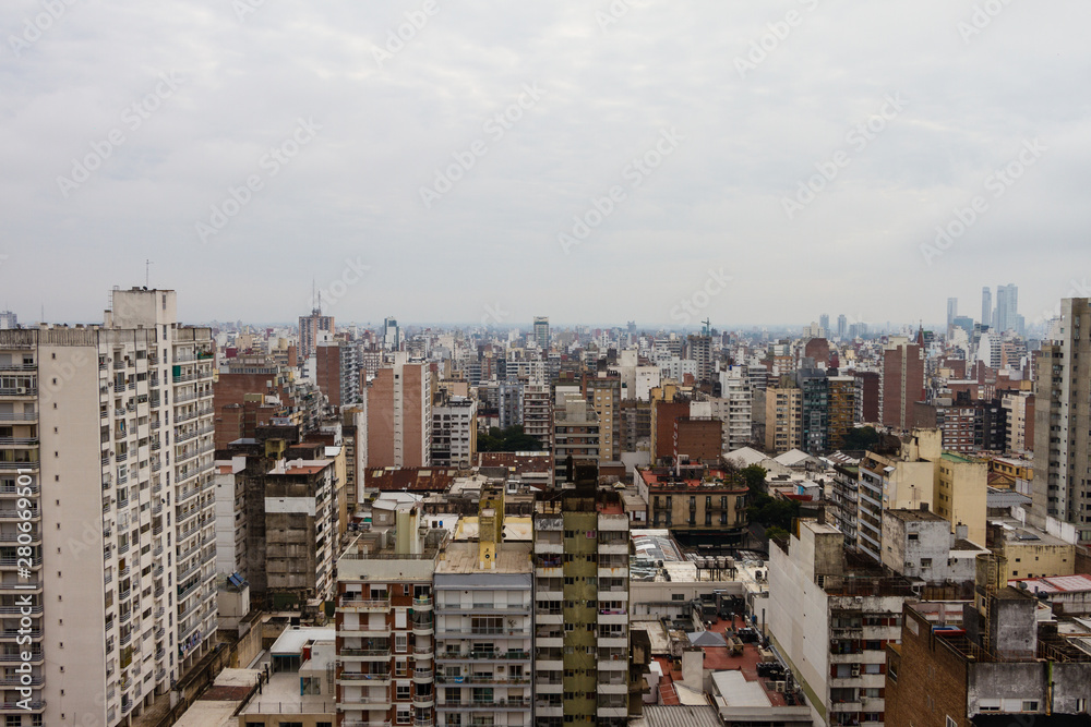 Fototapeta premium View of Rosario city at a cloudy day. Rosario view from the top. Rosario City with buildings. Skyline. Rosario, Santa Fe, Argentina.