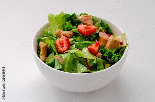 fresh Chicken salad with strawberries on white background