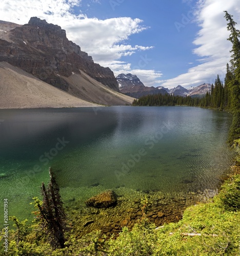 Vertical Landscape View of Beautiful Haiduk Lake and Rugged Mountain Peaks in the Background. Banff National Park Summertime Canadian Rockies photo