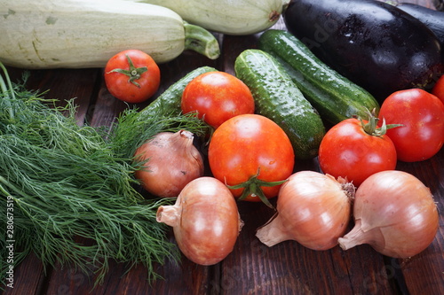 different vegetables on a dark wooden table