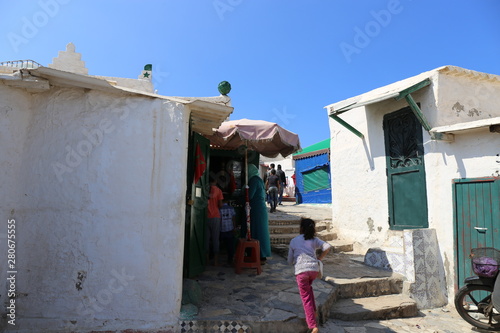 A young girl running back to her mother in the medina of Casablanca, Morocco.