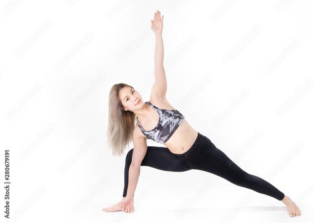 Sporty Asian young woman doing yoga practice isolated on white background.