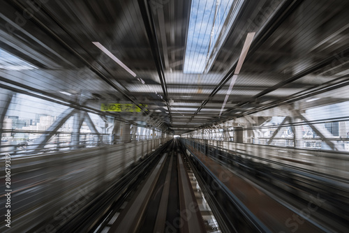 motion-blurred view from a moving train running in tunnel