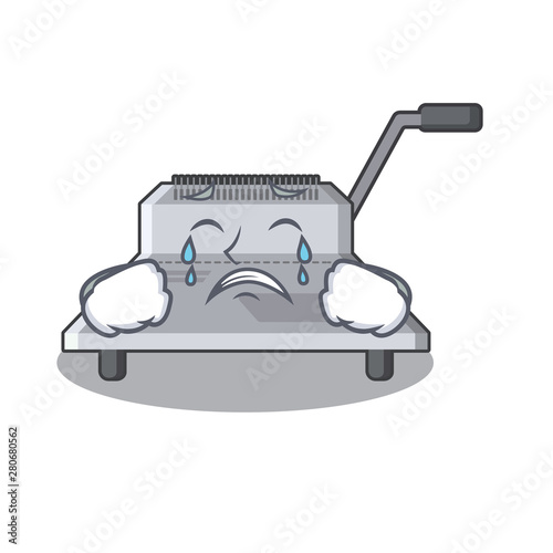 Crying binding machine above wood table cartoon