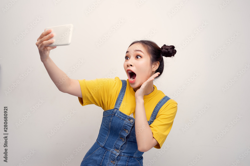 Portrait of her she nice cute fascinating attractive lovely sweet cheerful cheery girl lady holding cell in hands Portrait of her she nice cute fascinating attractive lovely sweet cheerful cheery girl lady holding cell in hands