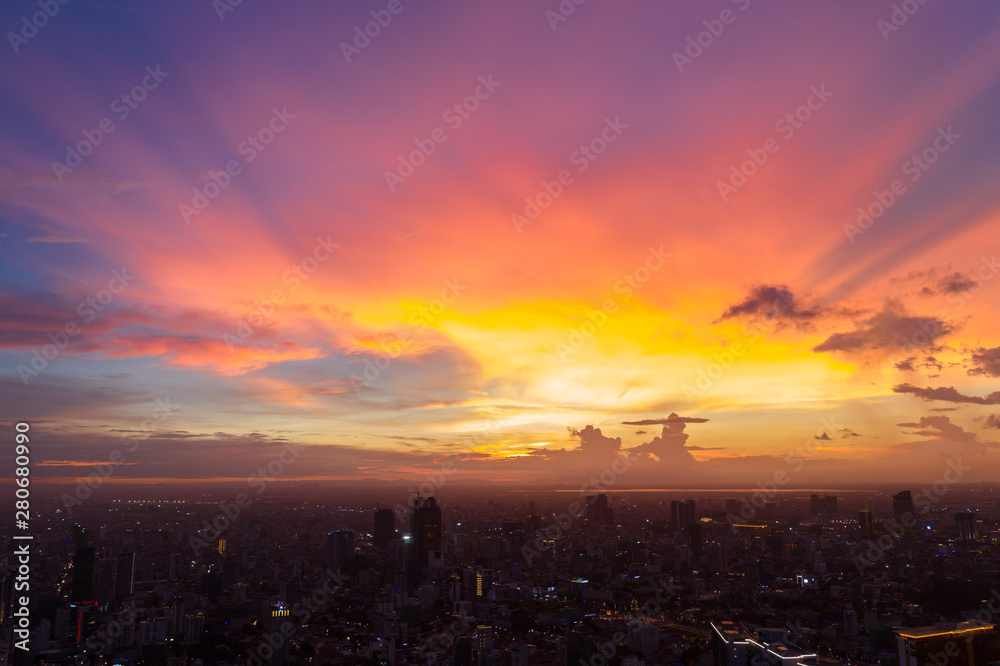 Top View of Building in a City - Aerial view Skyscrapers flying by drone of Phnom Penh city with riverside , Palace and small island in sunset