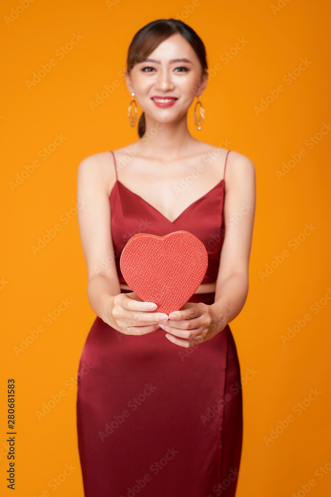 Portrait of Beautiful woman with red heart shaped box Portrait of Beautiful woman with red heart shaped box