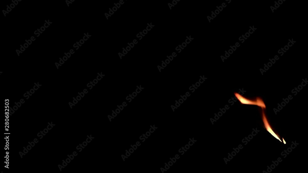 bright red yellow flames of fire in the dark. black background bright red yellow flames of fire in the dark. black background