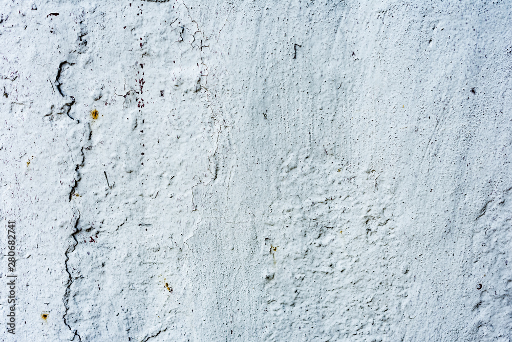 Obraz premium Texture of a concrete wall with cracks and scratches which can be used as a background