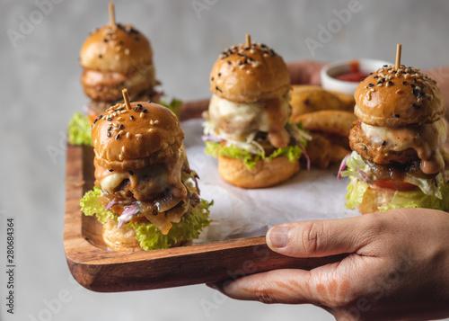 Mini burgers in a wooden tray