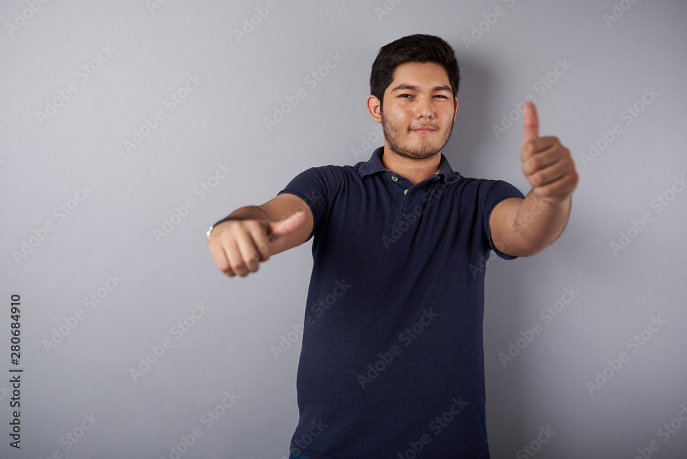 Cheerful young latin man with thumb up Cheerful young latin man with thumb up