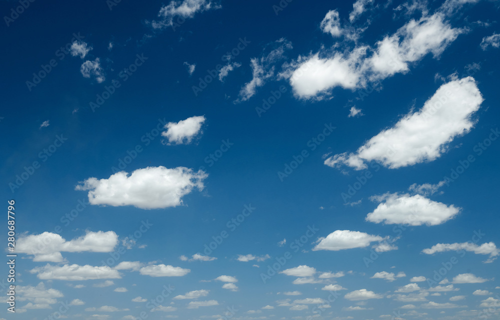 Obraz premium Bright beautiful blue sky with clouds for background or texture