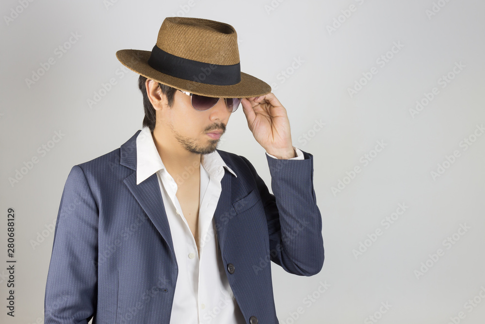 Portrait Man in Navy Blue Suit and White Shirt and Hat Touch Glasses Fashion on Side View Portrait Man in Navy Blue Suit and White Shirt and Hat Touch Glasses Fashion on Side View