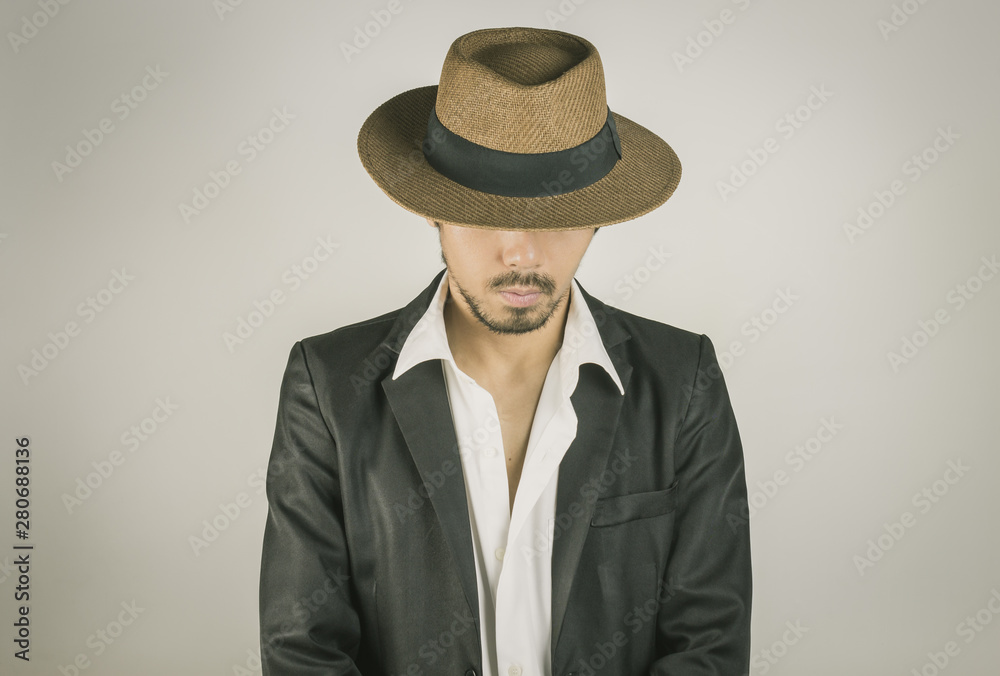Portrait Man in Black Suit and Hat Fashion on Front View Vintage Tone Portrait Man in Black Suit and Hat Fashion on Front View Vintage Tone