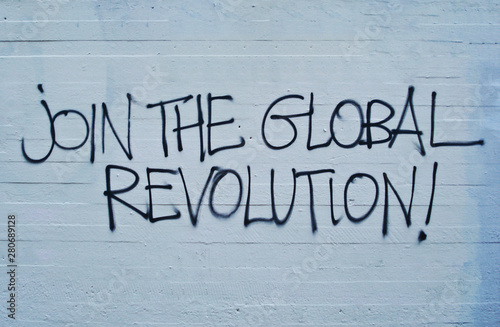 Fototapeta Join the global revolution written on the wall