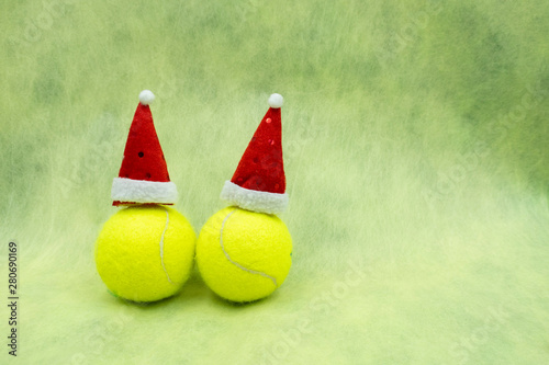 Merry Christmas to tennis player with tennis ball and Christmas ornament