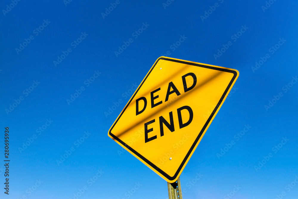 Dead end road sign on a blue clear sky day. Dead end road sign on a blue clear sky day.