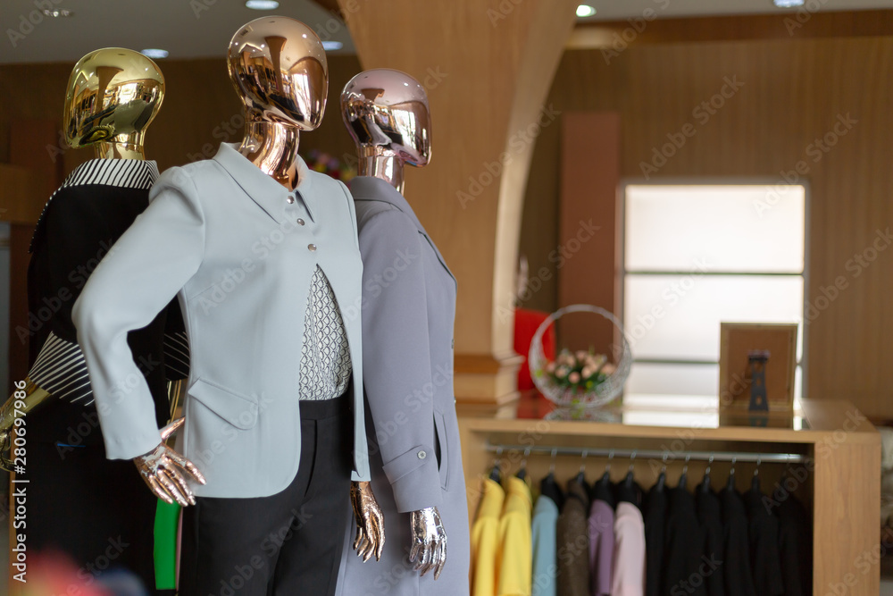 Female clothinh suit on mannequin at suit shop