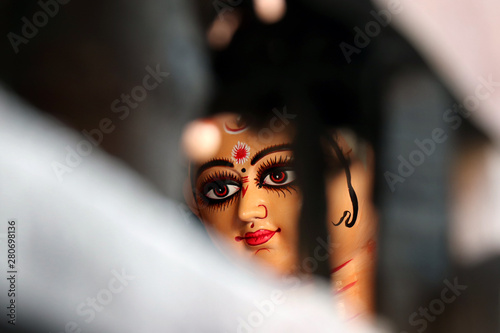 Idol of Hindu Goddess Durga during preparations in Kolkata. Clay idol of Goddess Durga, under preparation for Bengal's Durga Puja festival at Kumartuli Kolkata. Durga Puja is biggest festival in India