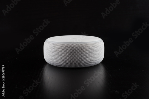 Digital voice assistant with computer and black background