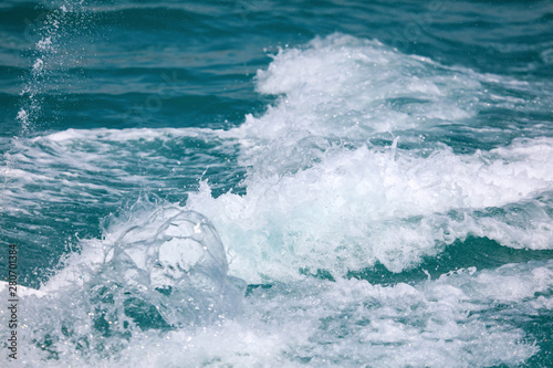 Splashing water from a boat into the sea