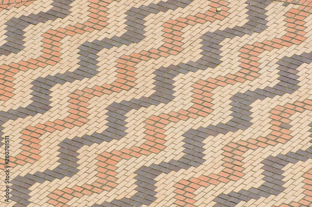 Brick paving stones on a sidewalk in Birmingham in England. Zig zag pattern with brick stones. Brick paving stones on a sidewalk in Birmingham in England. Zig zag pattern with brick stones.