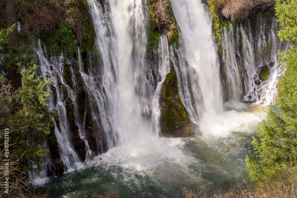 Close up of Burney Falls waterfall with Rainbow near Redding, in California