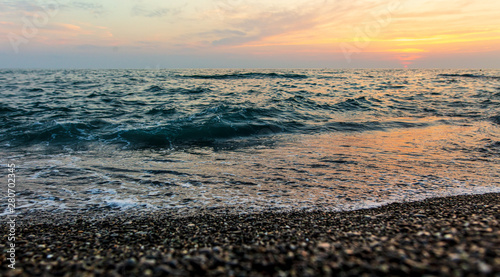 Waves on the seashore at sunset
