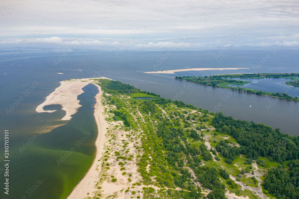 Aerial view of the Vistula river mouth to the Baltic sea. Poland. Photo made by drone from above. Bird eye view.