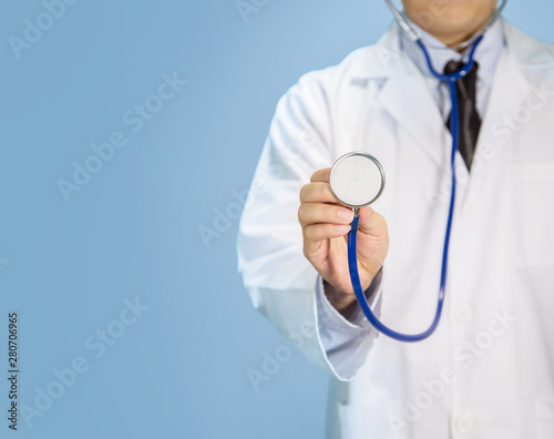 Doctor in empty blue background with copy space