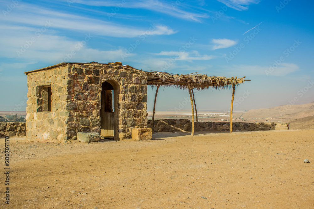poor ghetto small stone house of some Arabian Bedouin owner in country side desert dry scenic natural environment 