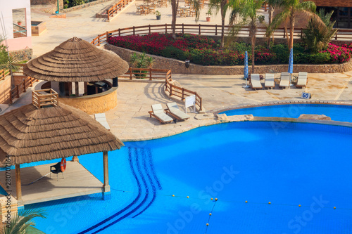 Aerial view of the swimming pool with clear water in tropical resort