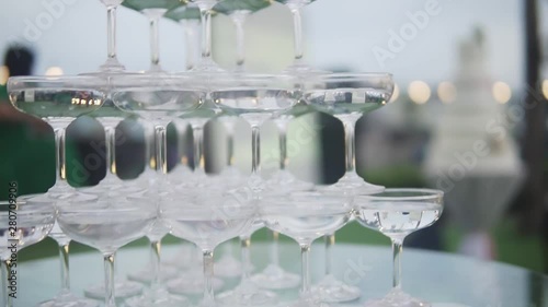 Wedding catering. Celebration marriage concept. Restaurant and bar alcohol menu. Luxury drink. Banquet service outdoor. Cocktails in pyramid setup decor.