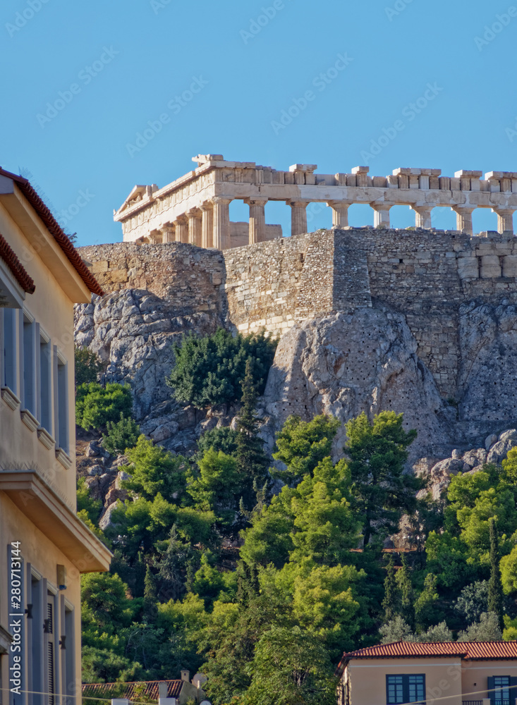 Fototapeta Athens Greece, unusual view of Parthenon ancient temple from the street behind acropolis hill