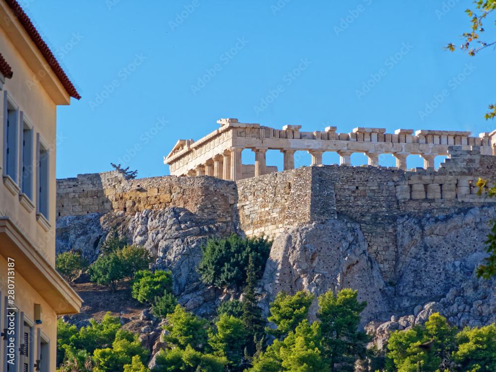 Fototapeta Athens Greece, unusual view of Parthenon ancient temple from the street behind acropolis hill