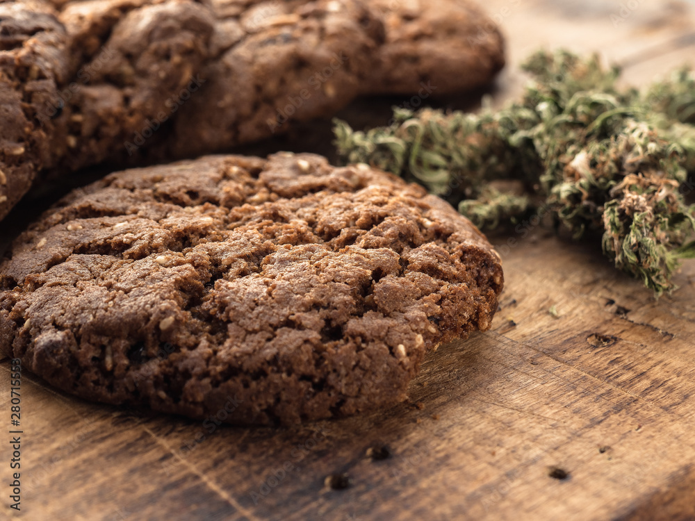 Fototapeta premium textured chocolate hemp oatmeal cookies on a wooden board