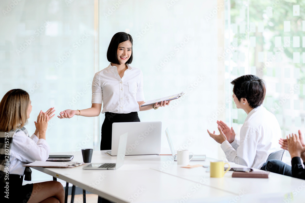 Group of business asian people hands clapping after businesswoman presenting. Group of business asian people hands clapping after businesswoman presenting.