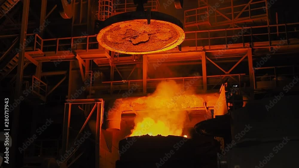 Smelting of the metal in the foundry. Hot steel, metallurgy background.